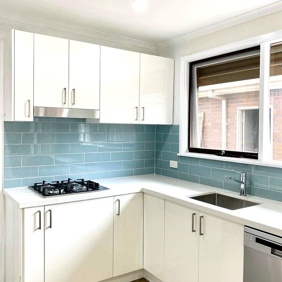 Kitchen renovation with blue splashback
